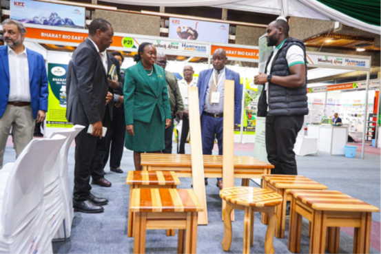 Cabinet Secretary Debora Barasa engaging with experts during her visit to the KEFRI exhibition stand at WoodTech Africa 2025 at KICC